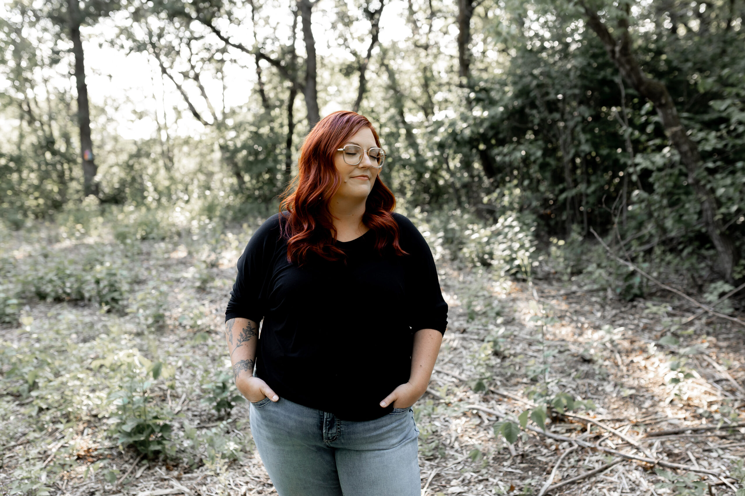 Woman standing in trees